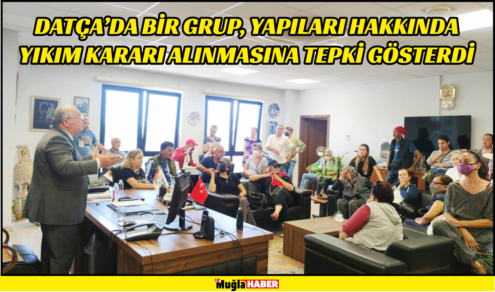 Datça'da bir grup, yapıları hakkında yıkım kararı alınmasına tepki gösterdi